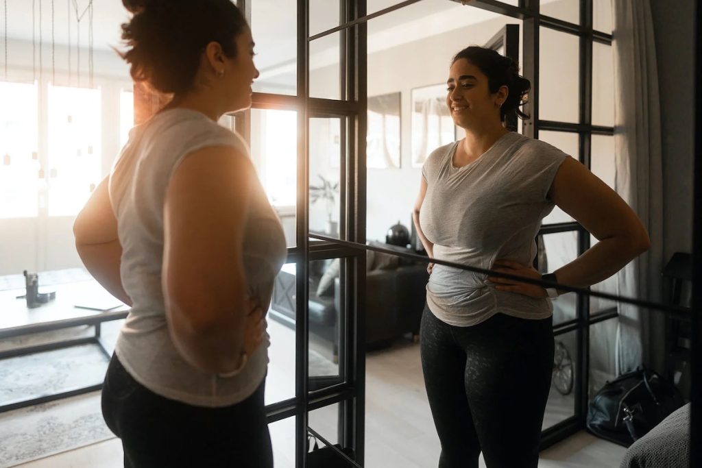 fibroids diagnosis mirror woman looking at her own reflection